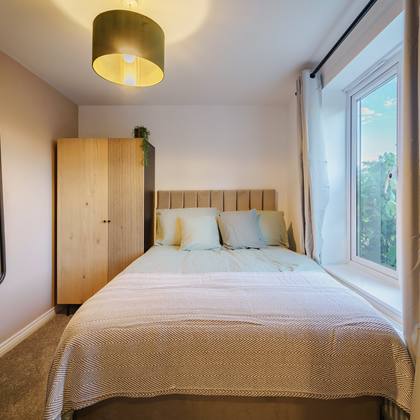 Room 1, double bed and wardrobe