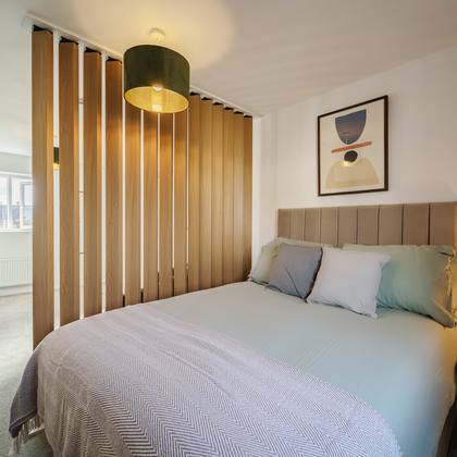 Room 6, double bed behind the timber screen